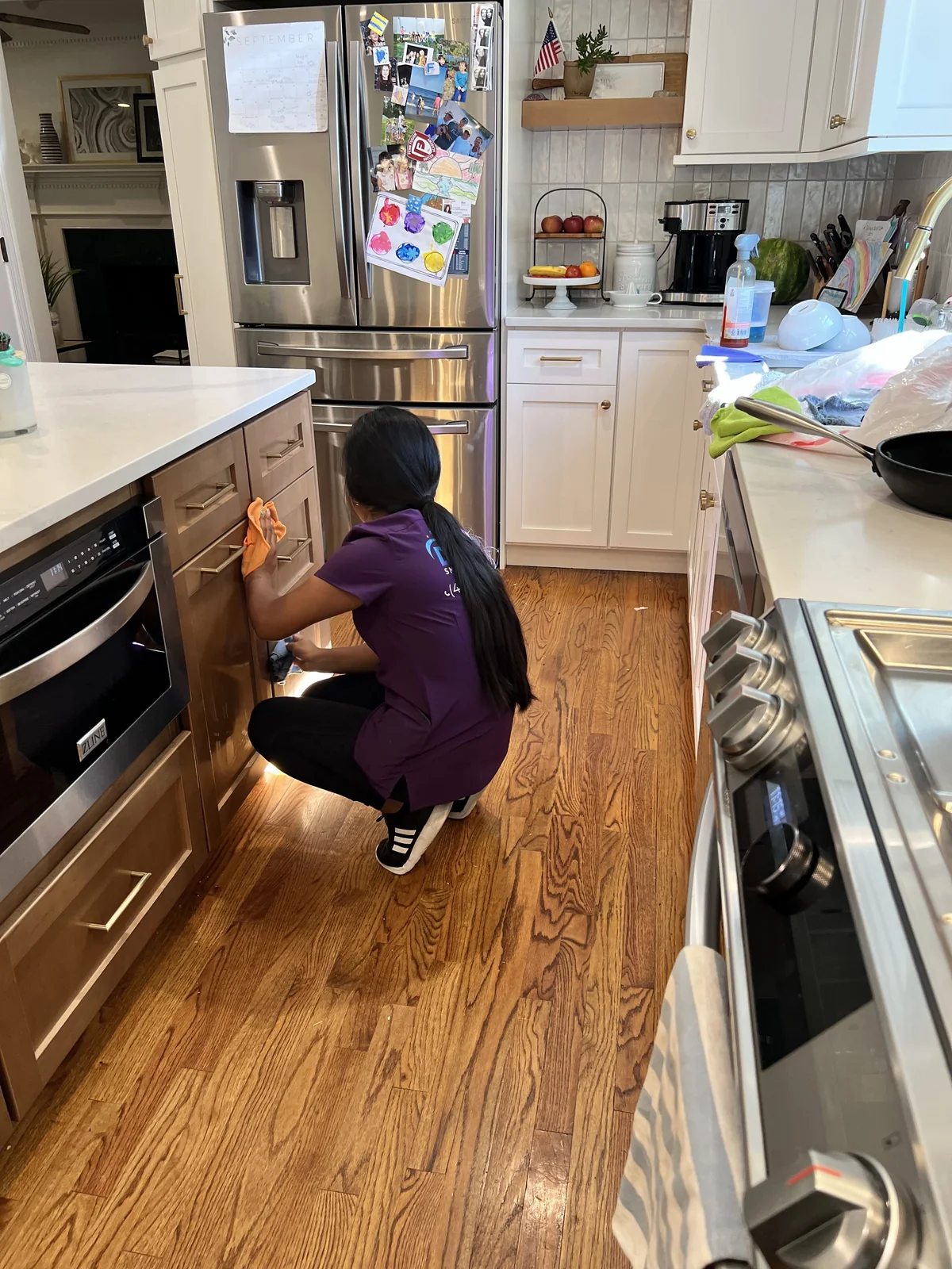 Daily Smart Cleaning professional carefully cleaning kitchen cabinets