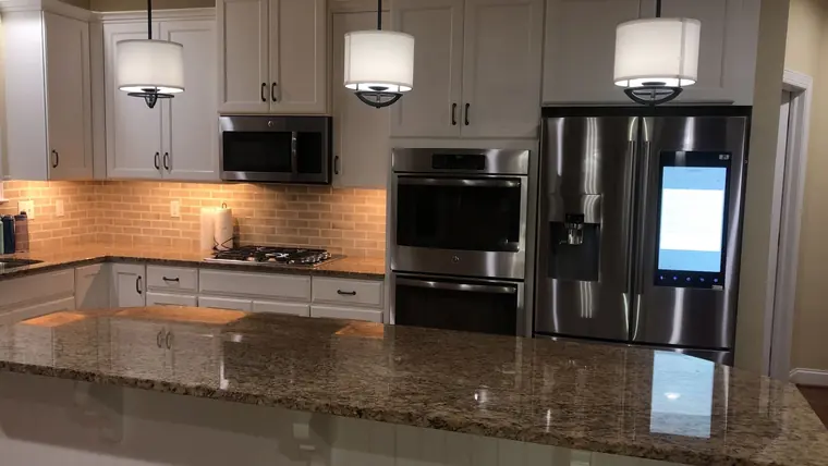 Clean residential kitchen with polished counters and appliances