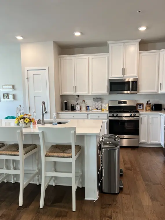 White residential kitchen cleaned and organized