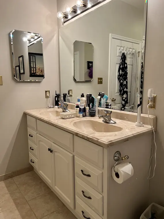 Bathroom vanity and mirror after detailed cleaning