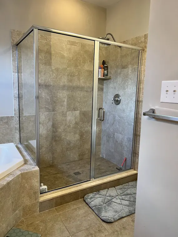 Stone shower enclosure after professional cleaning