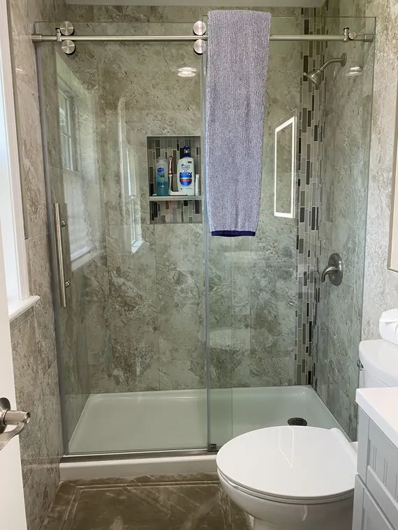 Marble shower cleaned and organized